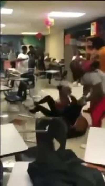 Teacher breaks up fight