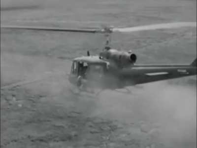 114th Aviation Company UH-1 Huey gunship in action during an air mobile seek and destroy operation in Phuoc Tuy in early 1965
