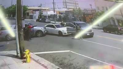 ICE hit & swarm a vehicle in LA immediately deploying tear gas and holding the occupants at gunpoint. The 2 men are US citizens per wife of one man