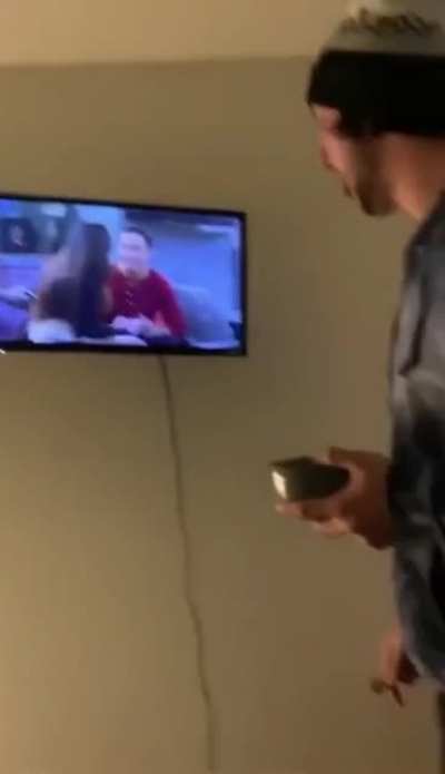Trying to put a broken TV out of it's misery.