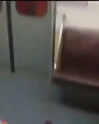 A Giant freaks out in the subway before reaching the station he breaks the window with his bare hands and then rips open the doors.