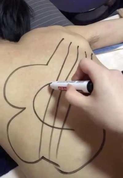 Drawing on his back