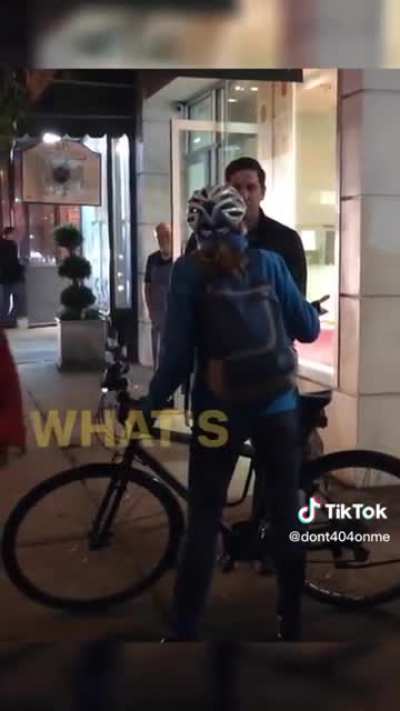 Woman on a bike yelling at a man walking his dog and refusing to let him get by