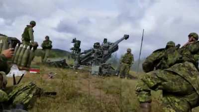 Canadian soldiers waking up their buddy