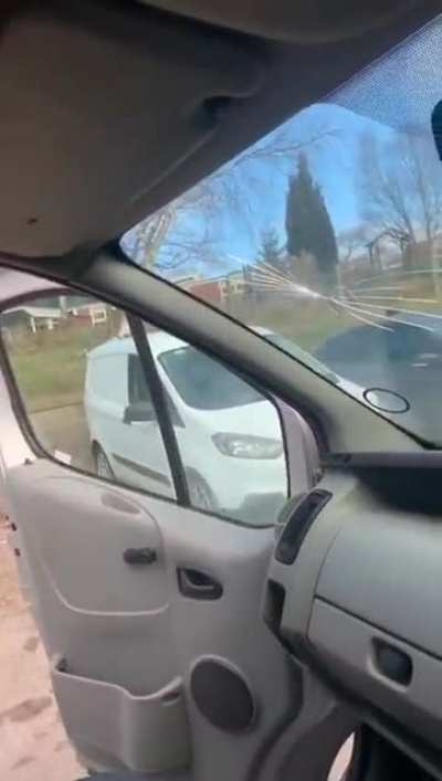 More concerned with his windshield than the lad's head!