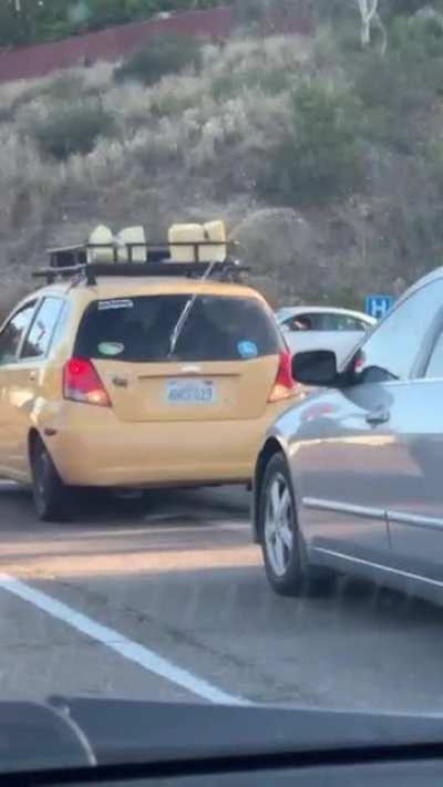 He honked at the orange car.