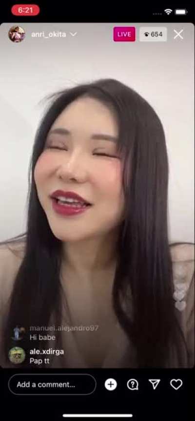 JAV actress Anri Okita leaning back to show massive breasts