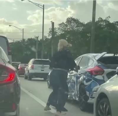 Girl freaks out while stopped at red light