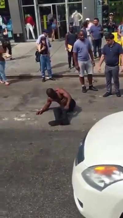 Dude KO'd on a hot day outside McDonalds in NYC