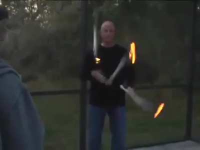 WCGW standing next to a guy juggling fire