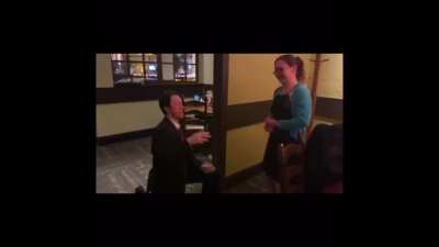 Olive Garden Wedding Proposal complete with a costume, fedora, and &ldquo;I guess it&rsquo;s a yes?&rdquo;
