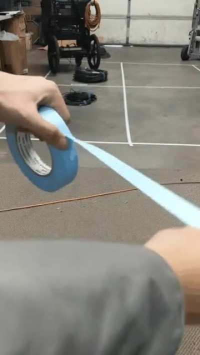 Pulling tape over to the side so you don&rsquo;t have to waste time peeling it off on the next use.