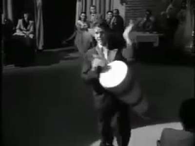 Actor Desi Arnaz performing Babalu on the hugely successful 1950s American sitcom 'I Love Lucy'. Most Americans would not have realized this is a praise song in honor of the powerful deity Babal&uacute;-Ay&eacute;. The ancient West African Orisha faith was preserved by