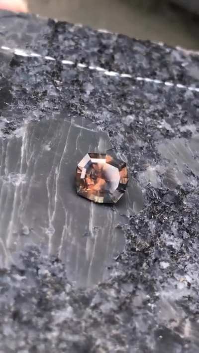 Spooky 👻 montana sapphire just finished cutting for Halloween 🎃 1.15 ct modified cut stone 6.4 mm x6 mm There is whole other universe inside the stone . Mikey orange and blue colors Available.