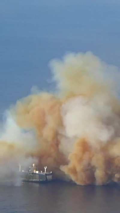 Blue Origin's New Glenn rocket booster landing successfully on a drone ship