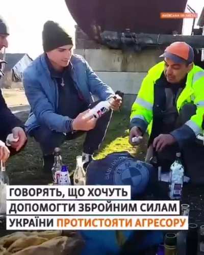 Civilians preparing Molotov cocktails in Kiev.