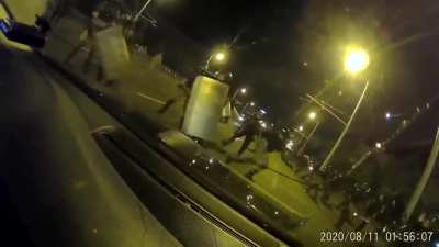 A group of russians driving thro Minsk riots with a russian number plate, the riot police went mental on them