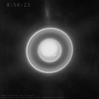 Animation showing the moons (blurred smudges) orbiting the planet Uranus and showing the rotation (movement of a spot). Other elongated object moving from top to bottom are background stars. Processed by Melina Th&eacute;venot