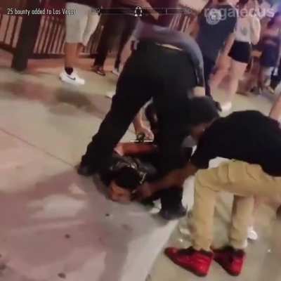 Couple try to steal gold diamond necklace off man's neck while he is lying handcuffed