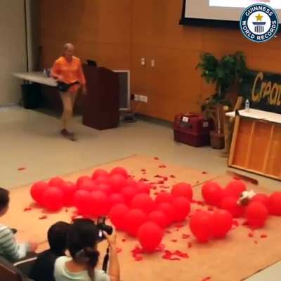 Fastest time to pop 100 balloons by a dog - Guinness world records.