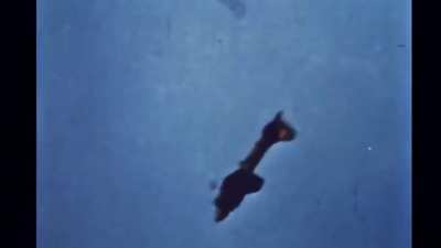 A B-17 going down during a bombing mission. The crew talking is the "Memphis Belle."