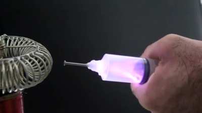 Extracting electricity from a tesla coil using a syringe. OP: u/solateor