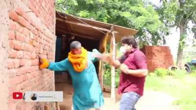 Reporter slapped local politician for arranging public gathering without wearing a mask.
