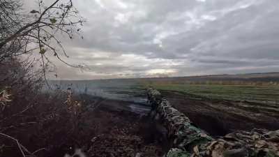 Footage of Ukrainian T-64BV engaging a Russian trenchline across a ridge with direct fire for a bit and then launches smokes to exit the area