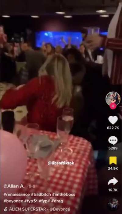 Karen jumps the stage at a drag show, gets politely removed from the stage by the performer.