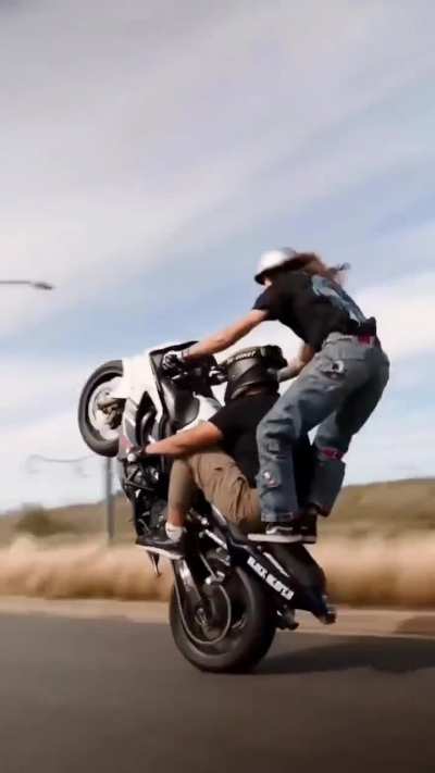 WCGW doing a wheelie with two people?