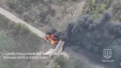 Drone footage of a Ukrainian tank raming a burning Russian MT-LB that was obstructing passage under the railway bridge near Selydove, Donetsk Oblast.