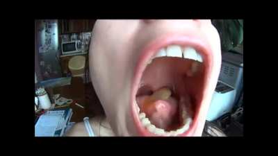 Woman Open Mouth Swallows a Fish