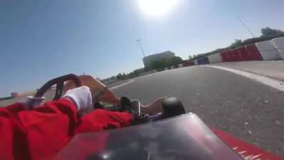 Taking a corner flat out on a dusty track