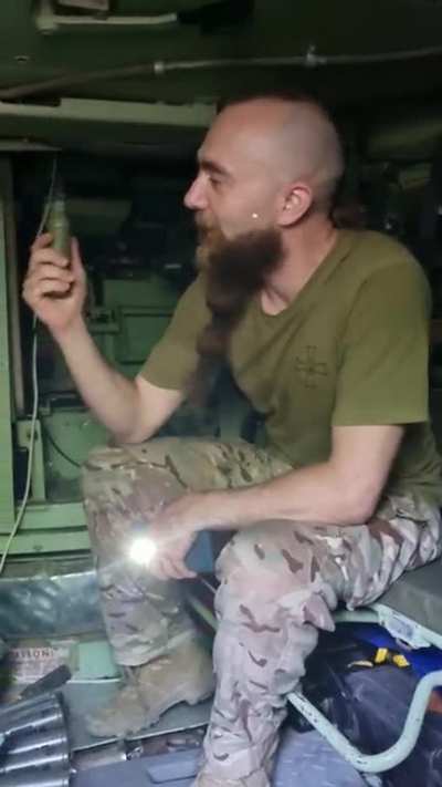 Curious George, Ukrainian soldier's guided tour of the Bradley fighting vehicle... braided beard no extra charge