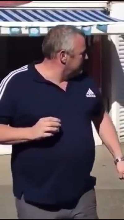 Bloke lands a left hand on seagull which try to steal his prawns