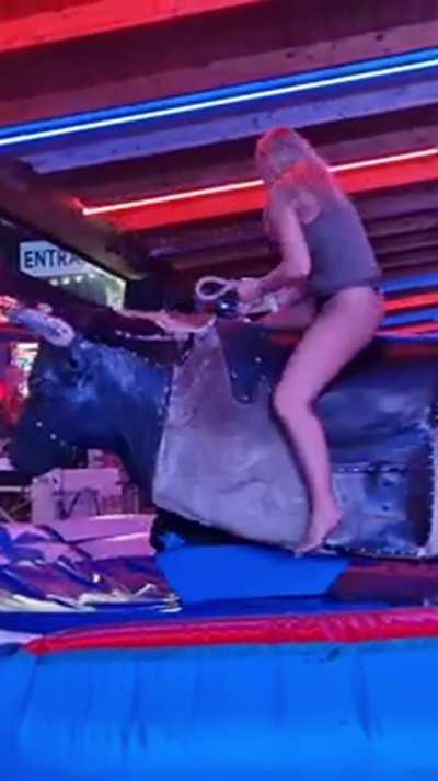 Sexy Blonde's Dress Riding Up On The Bull Revealing Her Black Thong