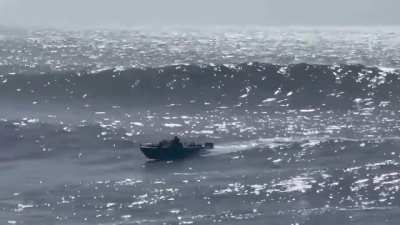 WCGW when you try to outrun massive Santa Cruz ocean waves in a teeny-tiny boat?