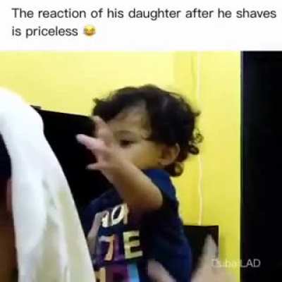 the girls reaction when she looks at her father without beard.