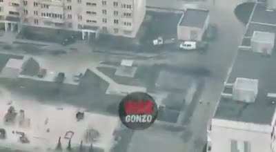 Ukrainian military on rooftops of residnetial buildings flimed by Russian drones.