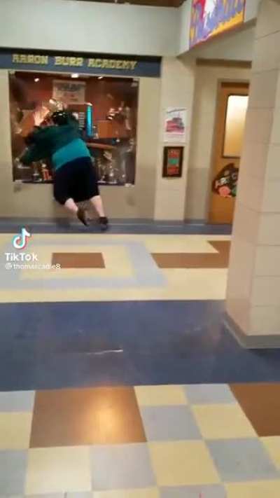 why tf this bih roller skatin in school ? 🤣🤣