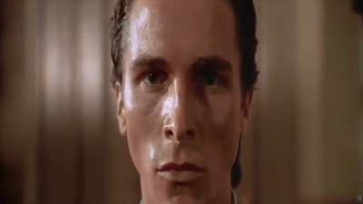 Patrick Bateman staring at the camera while bringing it closer to his face be like :