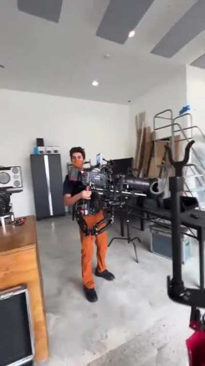 This is how cinematographers operate large &amp;amp; heavy camera with ease using a body-mounted jig