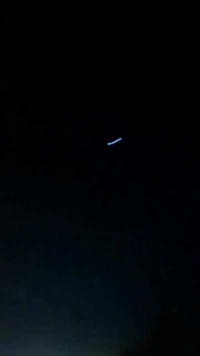 Unidentified flying object observed in Iran last week: first segment shows excited people noticing the object; second part shows Iranian military air defense systems shooting towards the object. Object shows no reaction to the shooting, eventually disappe