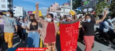 Young Women lead a flash protest in Myanmar against military rule