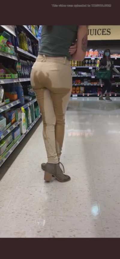 Girl peeing her tan pants.