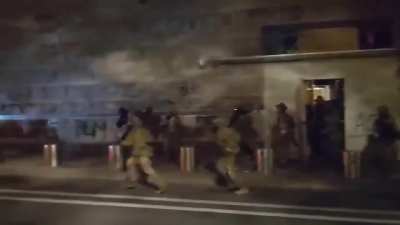 Guy tries to ambush police with a hammer, gets taken down.