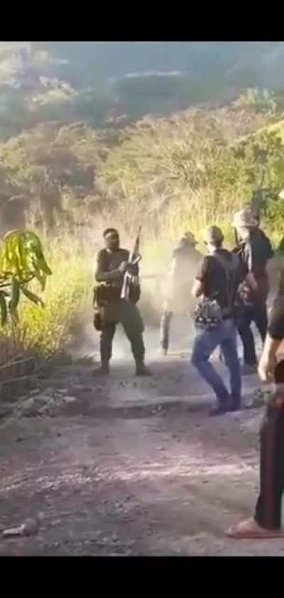 Sicario from CDS hip-firing a FN M249 SAW with a 200 round ammo box while another sicario single handedly, mag dumps a fully automatic AK47 before a sicario hip fires a Barrett M107A1 in the sierra of Sinaloa, M&eacute;xico.
