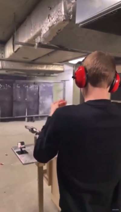 Guy bump fires and almost taps his head with the second shot.
