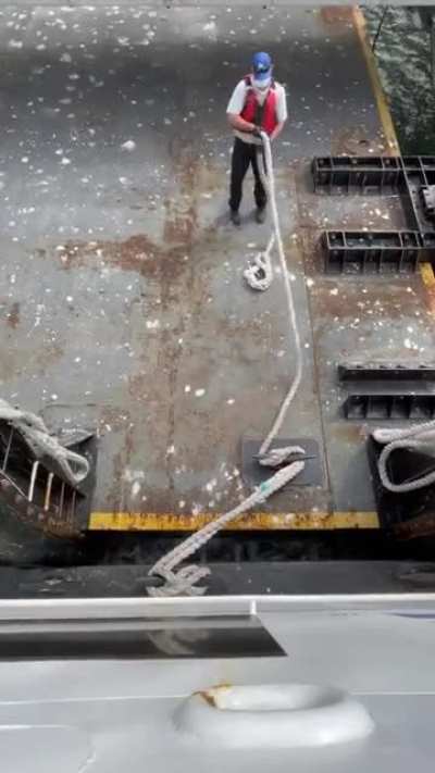 Worker with a great skill in mooring boats