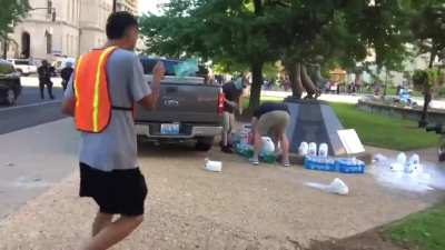 Cops sneak up to confiscate & destroy water and other supplies peaceful protestors are using in Louisville, KY